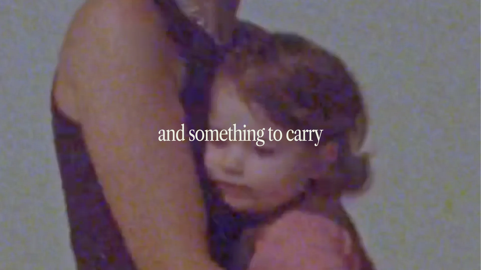 Mother holding child — still from the Mavie product film